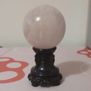 Elegant Rose Quartz Sphere on Black Stand